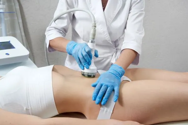 Lost the Weight but Not the Loose Skin? 2 woman having HIFU treatment on her stomach to combat loose skin Waltham Forest following weight loss